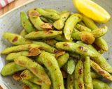 A picture of step 7 of Irresistible Spicy Grilled Edamame.