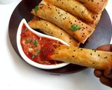 A picture of step 15 of Crunchy chicken filo cigars.