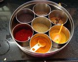 A picture of step 1 of Aloo chorifali and tomato sabji.