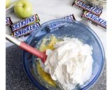 A picture of step 1 of Caramel Apple Snickers Salad.