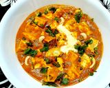 A picture of step 4 of Paneer Butter Masala with fresh cream.
