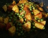 A picture of step 10 of Peas Tomato Potato Curry.
