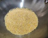 A picture of step 1 of Corn daliya upma.