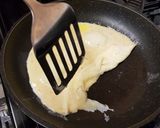 A picture of step 5 of Scambled Egg on Toast.