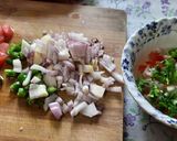 A picture of step 1 of Egg tomato onion omlette.