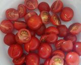 A picture of step 1 of Tomato, red onion, basil and balsamic salad.