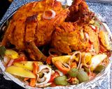 A picture of step 4 of Steam chargha with vegetables sizzling.