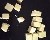 A picture of step 3 of Paneer tikka masala with cheese naan.