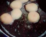 A picture of step 8 of The Happiness with Chocolate filled mini donuts.