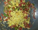 A picture of step 10 of French beans chicken and veg fried rice.