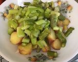 A picture of step 13 of Warm Potato and Asparagus Salad with Bacon, Tomatoes, and Sweet Onion.