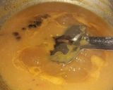 A picture of step 3 of Veg clear soup with sliced boiled egg.