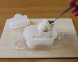 A picture of step 5 of Pork, Egg, Avocado & Tuna Onigiri.