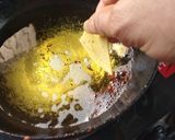 A picture of step 2 of Indian style simple Salsa nachos.
