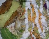 A picture of step 1 of lemon chicken w salad cucumber dressing.