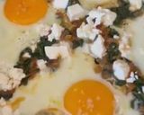 A picture of step 2 of Saganaki 🍳 with Eggs 🥚, Feta, Spinach 🌿, and Tomato 🍅 in a Skillet 🥘.