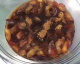 Une image de l'étape 2 de Compote de prunes au curaçao et sucre punjabi.