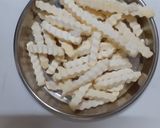 A picture of step 3 of Peri peri fries.