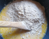 A picture of step 3 of Raspberry cinnamon rolls.