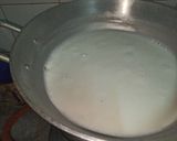 A picture of step 11 of Dodha Burfi with Daliya.