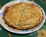 Une image de l'étape 14 de Tourte au munster, oignon, cumin et vin blanc.