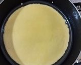 A picture of step 3 of Peach Swiss roll Ice cream Cake.