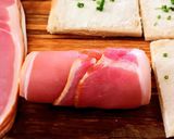 A picture of step 3 of Bacon-wrapped toasted bread rolls.