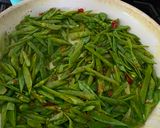 A picture of step 5 of Chinese stir fry - Snow Peas with dried shrimps and garlic.
