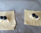 A picture of step 2 of Gorgonzola and blueberry triangle puffs.