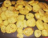 A picture of step 2 of Seasoned potatoes, kachumbari & pork sausages.