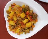A picture of step 10 of Veggies potato sauce.