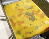 A picture of step 4 of Egg Tamagoyaki with Menma and Shiso.