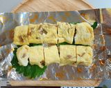 A picture of step 8 of Egg Tamagoyaki with Menma and Shiso.
