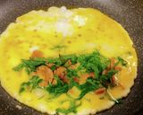 A picture of step 9 of Egg Tamagoyaki with Menma and Shiso.