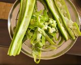 A picture of step 1 of Snake gourd ki sabji.