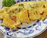 A picture of step 13 of Egg Tamagoyaki with Menma and Shiso.