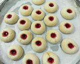 A picture of step 4 of Thumb Print Jam Cookies with White Butter.