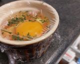 A picture of step 4 of Microwave Egg Cocotte with Bacon and Chives.