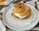 Foto del passaggio 6 della ricetta Zeppole fritte con ricotta gocce di cioccolato e arancia candita