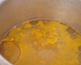 A picture of step 1 of Double tadka lahsuni Palak khichdi.