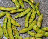 A picture of step 3 of Irresistible Garlic Butter Soy Sauce Grilled Edamame.