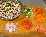 A picture of step 1 of Lobia chilla loaded with veggies.