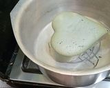 A picture of step 3 of 3 color cream cake.