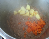 Foto del paso 4 de la receta: Potaje de garbanzos y champiñones en olla exprés