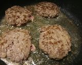A picture of step 3 of Fluffy's homemade hash brown cheese burger.