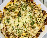 A picture of step 8 of Loaded Nachos with Mango Salsa, Sour cream and cheese sauce.