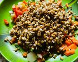 A picture of step 2 of Sprout Salad with carrots cucumber tomatoes.