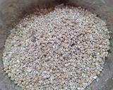 A picture of step 1 of Bajre ki khichdi (pearl millet khichdi).