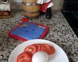 A picture of step 1 of Egg 🥚 with tomato 🍅.