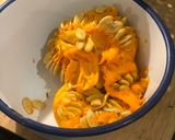 A picture of step 2 of Tray bake pumpkin & chicken thighs topped with roast pumpkin seeds.